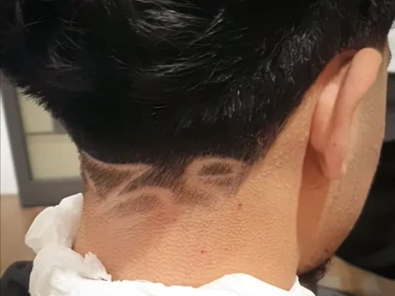 Fade and Hair Design Services Fade haircut with custom hair design detail