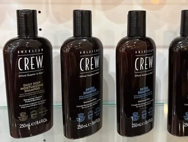 Hair and Body Grooming Products American Crew shampoo and body care products displayed in store